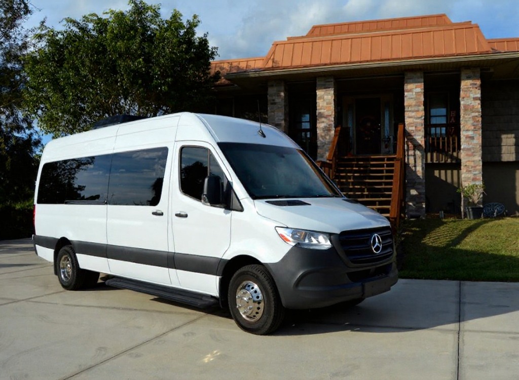 Exterior shot of 18 passenger party van parked in the Bronx